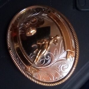 Signed Nickel Silver woman's barrel racing belt buckle